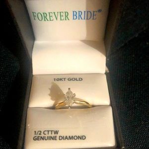1/2CT Marquis solitaire 10KT yellow gold ring